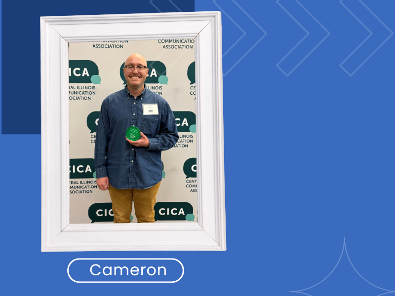 A photo of Nathan Cameron holding an award
