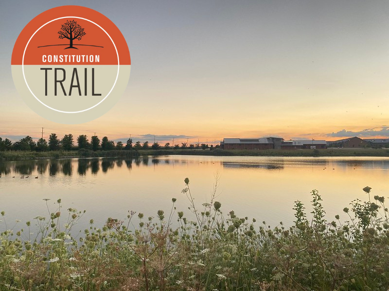 A photo of Birky Pond with the Constitution Trail logo