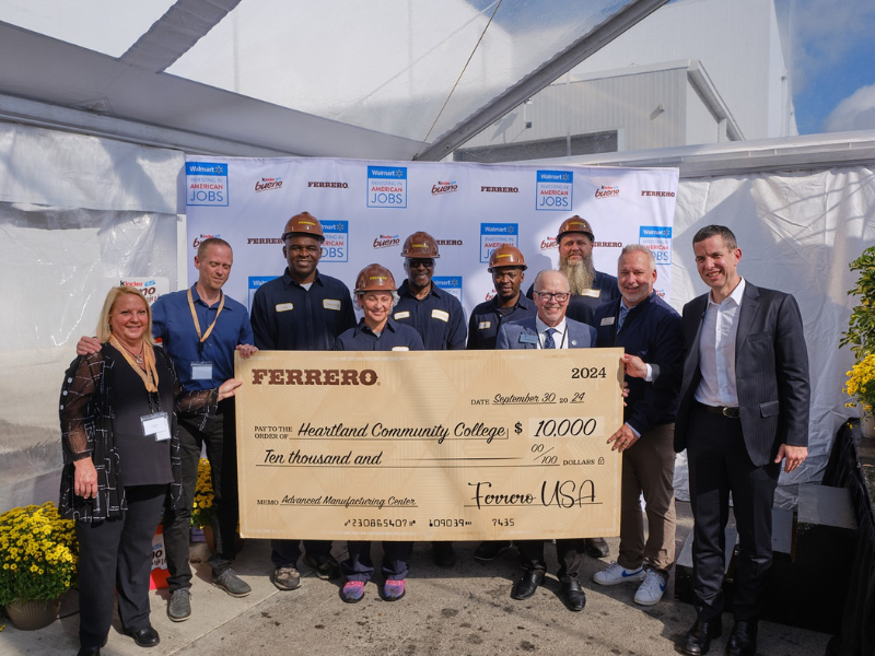 A picture of a group of people presenting a large check for $10,000 to Heartland Community College from Ferrero