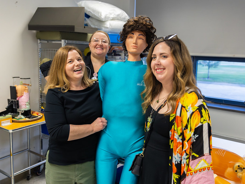 Photo of 3 women with a radiography dummy