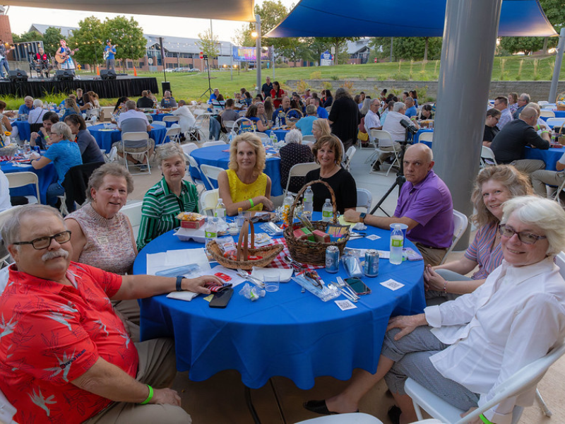 A picture of a group of people sitting around a table