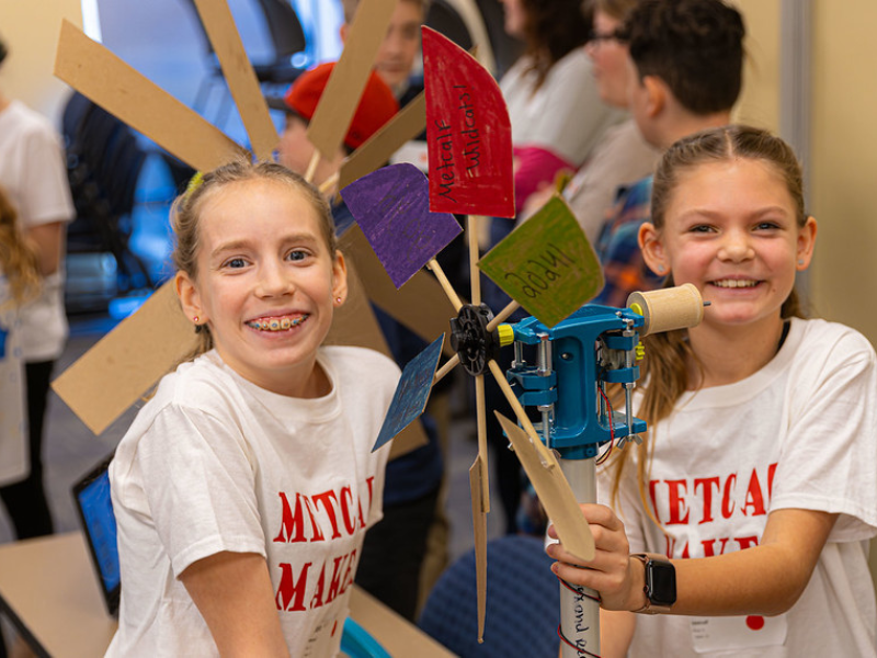 A photo of 2 girls with their creation