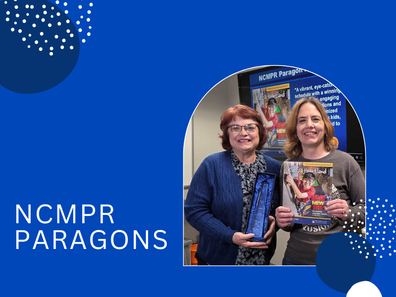 Anjanel Folkens and Jane Pickering with an award