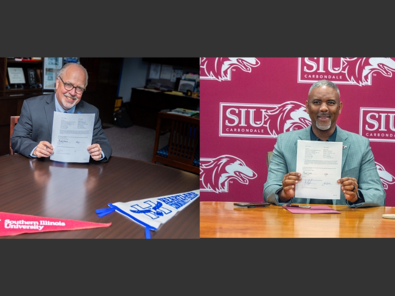 Picture of HCC president and SIU president with signed document