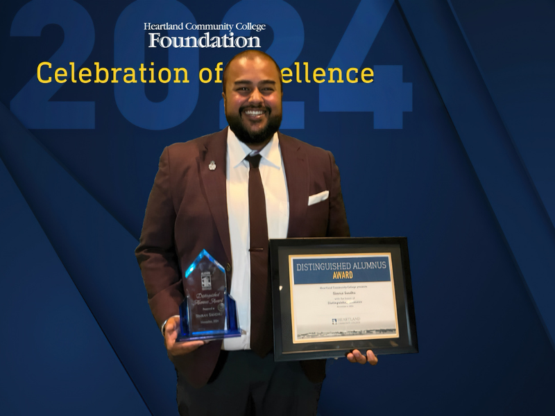 A picture of a gentleman holding awards