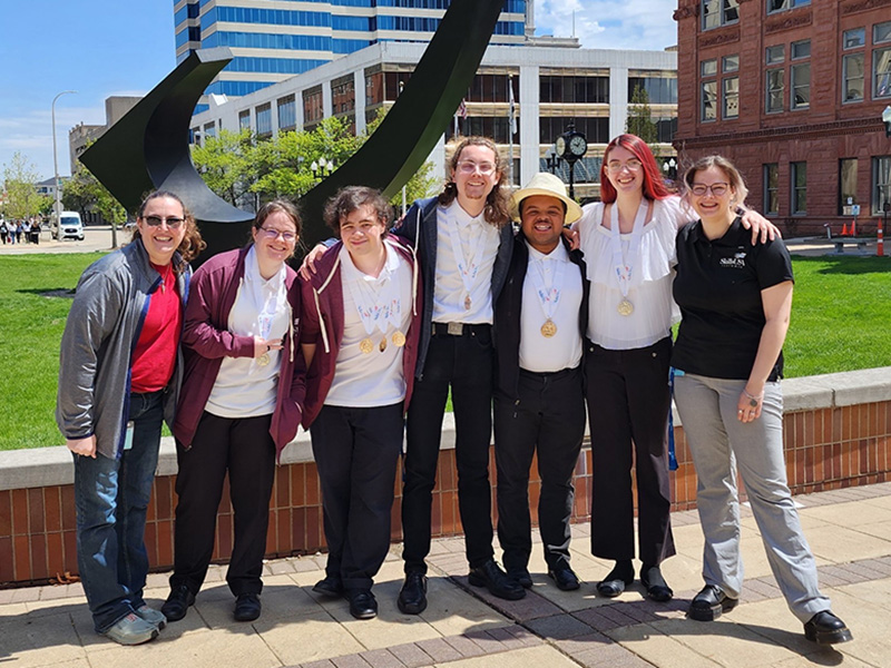 A picture of a group of students outside