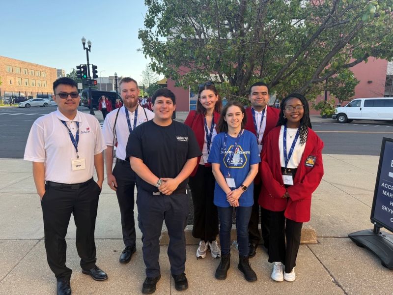 Skills USA student standing outside